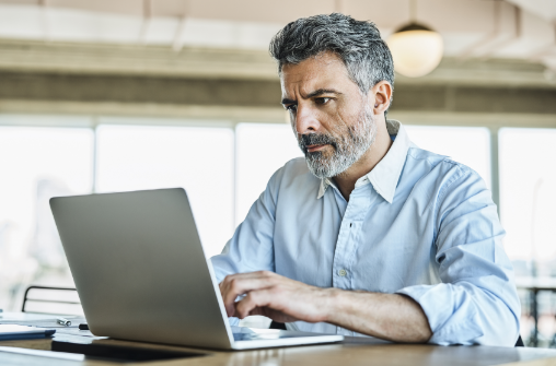 Businessman using Microsoft Dynamics 365 to streamline his business processes